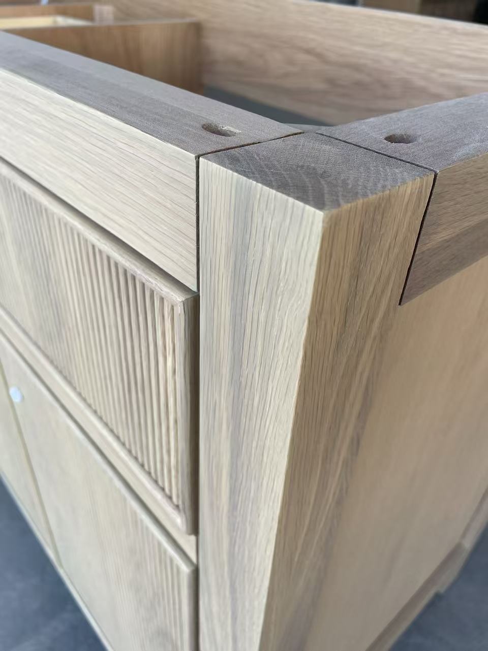 Close-up of mortise and tenon joinery on oak vanity frame